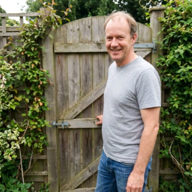 Photo of dad: receding light-brown hair, clean-shaven, grey t-shirt
